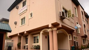 A building with a sign reading "B&B SUITES" indicating it is a bed and breakfast. - B & S Hotel (Lagos)