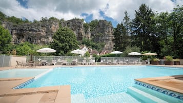 Outdoor pool, open 9:00 AM to 8:00 PM, free cabanas, pool umbrellas