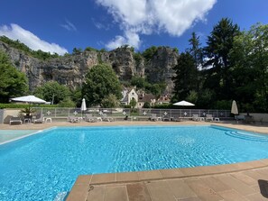 Outdoor pool, open 9:00 AM to 8:00 PM, free cabanas, pool umbrellas