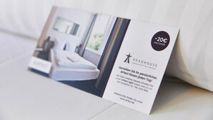 A brochure for Roadhouse Hotel with a 20% discount offer.