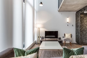 Apartment, 1 Bedroom | Living room | 32-inch flat-screen TV with satellite channels, TV - Soho Lofts by Aeria Apartments (London)