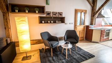 ซิกเนเจอร์อพาร์ทเมนท์, 1 ห้องนอน | บริเวณนั่งเล่น | ทีวีจอแบน