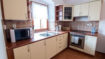 City Suite, 2 Bedrooms, Balcony | Private kitchen | Fridge, microwave, coffee/tea maker, electric kettle