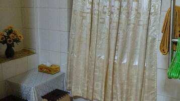Shower, free toiletries, slippers, towels