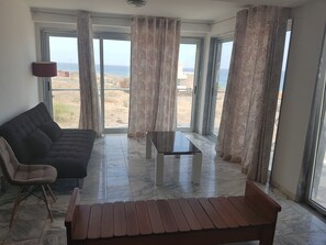 Deluxe Apartment | Living area | Fireplace