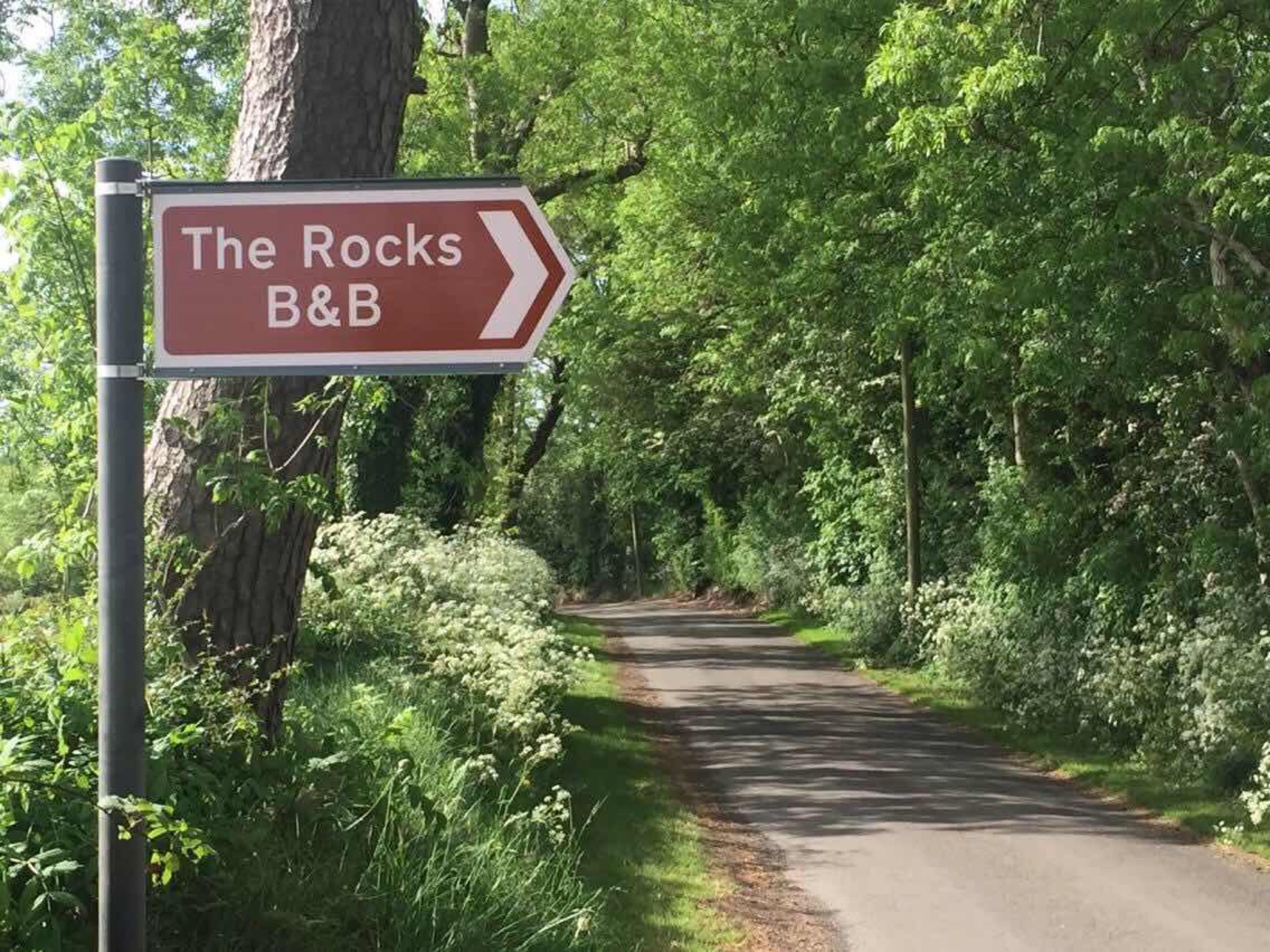 A directional sign for 'The Rocks B&B' pointing to the right.