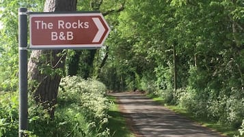 A directional sign for 'The Rocks B&B' pointing to the right.