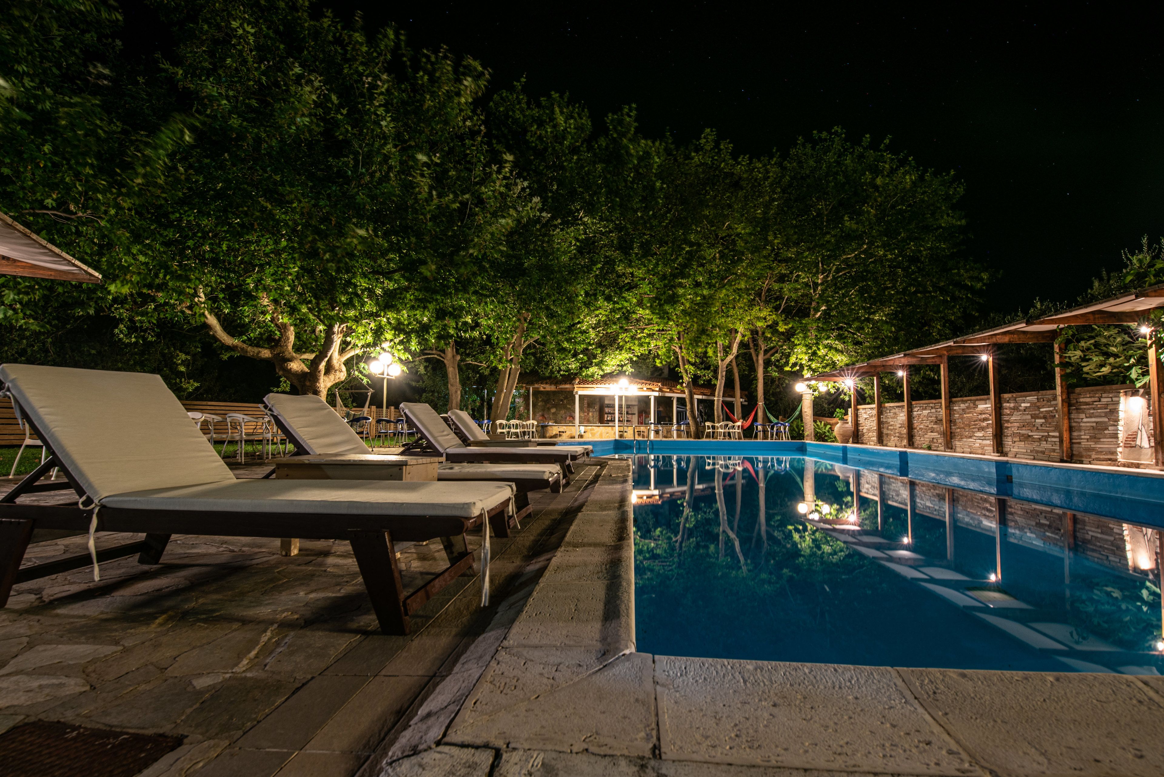 Seasonal outdoor pool, an infinity pool, pool umbrellas, sun loungers