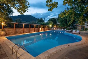 Seasonal outdoor pool, an infinity pool, pool umbrellas, sun loungers