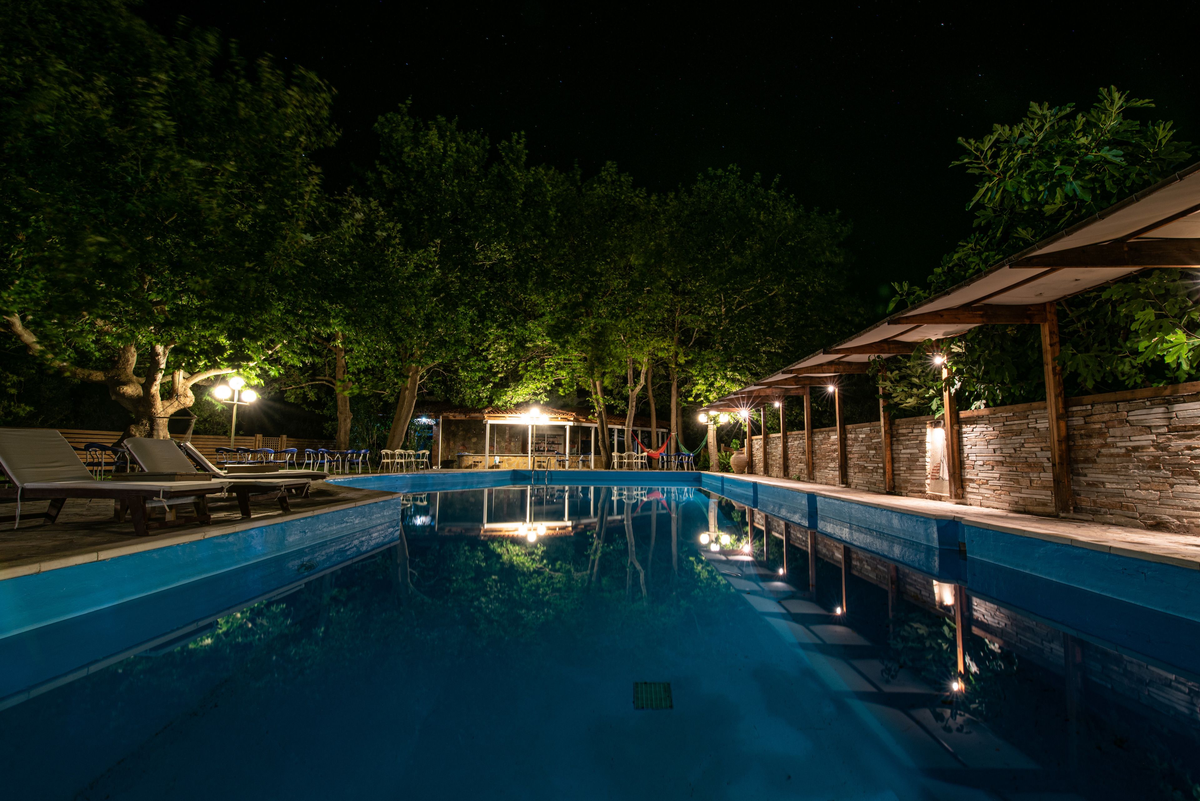 Seasonal outdoor pool, an infinity pool, pool umbrellas, sun loungers
