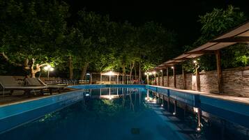 Seasonal outdoor pool, an infinity pool, pool umbrellas, sun loungers