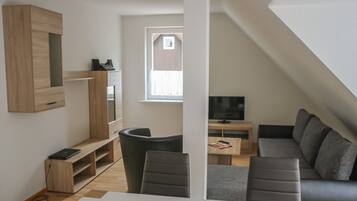 Apartment, 3 Bedrooms | Living room | Flat-screen TV