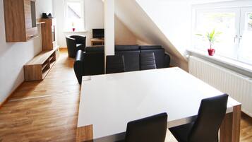 Apartment, 3 Bedrooms | Living area | Flat-screen TV