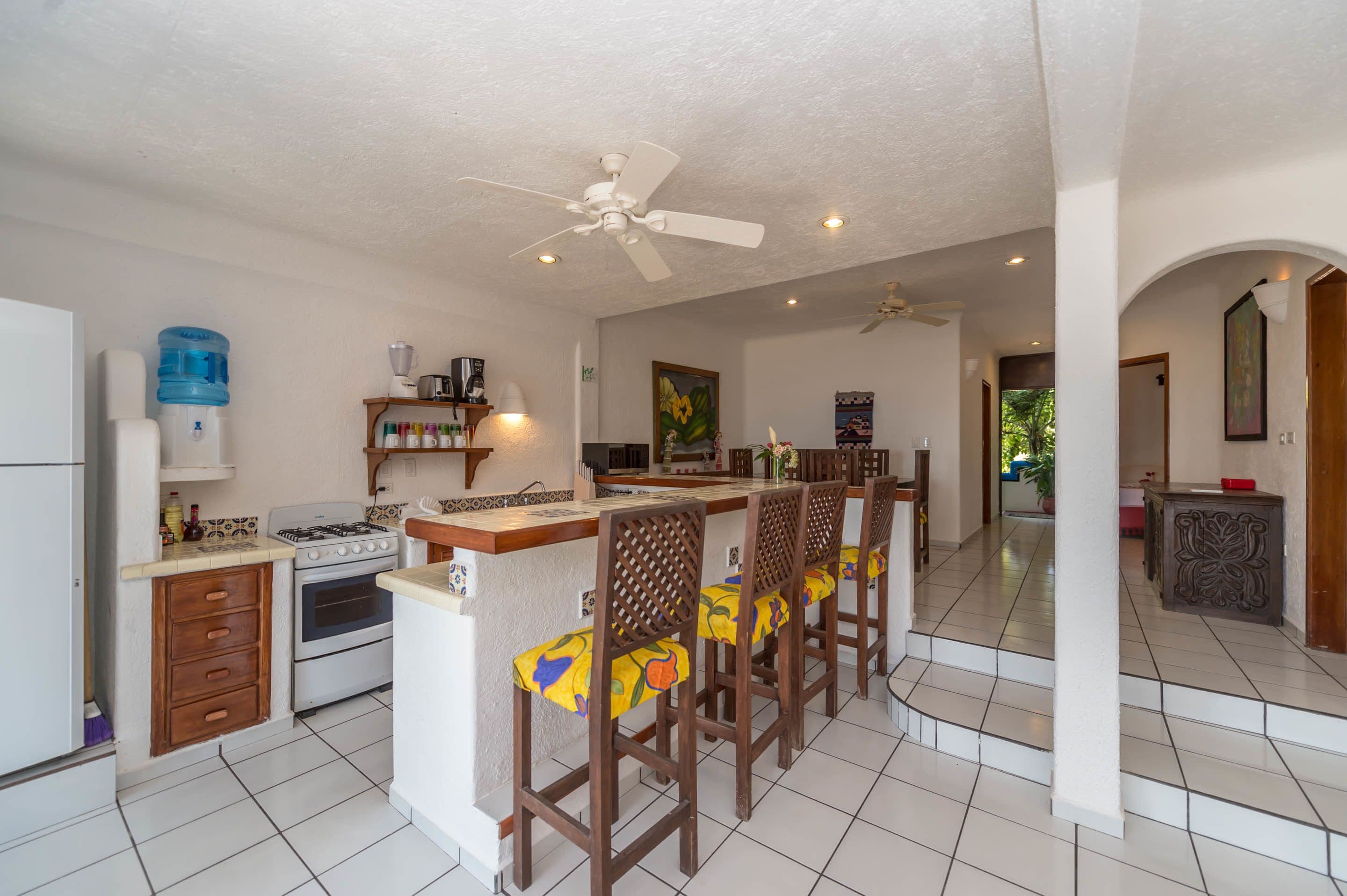 standard condo, 2 bedrooms, beachfront | private kitchen | full-sized fridge, microwave, oven, stovetop
