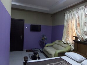 Premium bedding, desk, laptop workspace, iron/ironing board - De Love Hotel (Lagos)