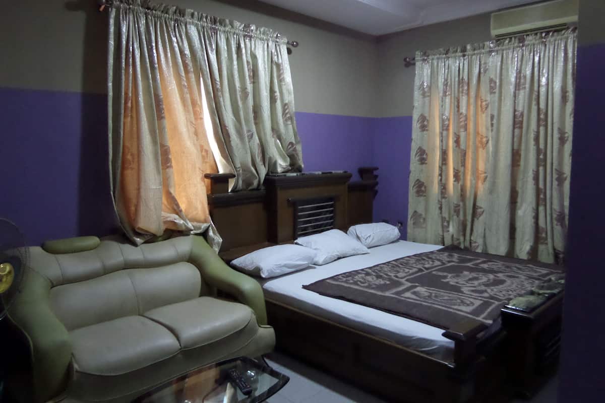 Premium bedding, desk, laptop workspace, iron/ironing board