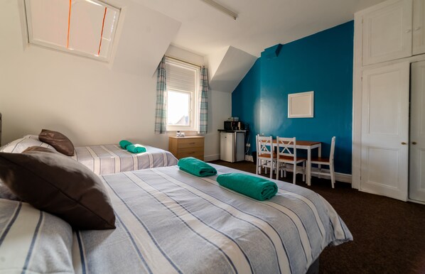 Family Quadruple Room, 2 Double Beds | Individually decorated, individually furnished, desk, iron/ironing board