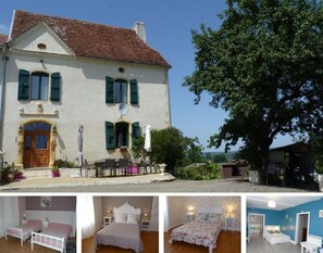 A two-story building with a traditional facade, a balcony with outdoor seating, and a large tree in the background. - Maison Hormidas (Crouseilles)