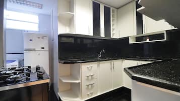 Apartment | Private kitchen | Fridge, microwave, stovetop, cookware/dishes/utensils