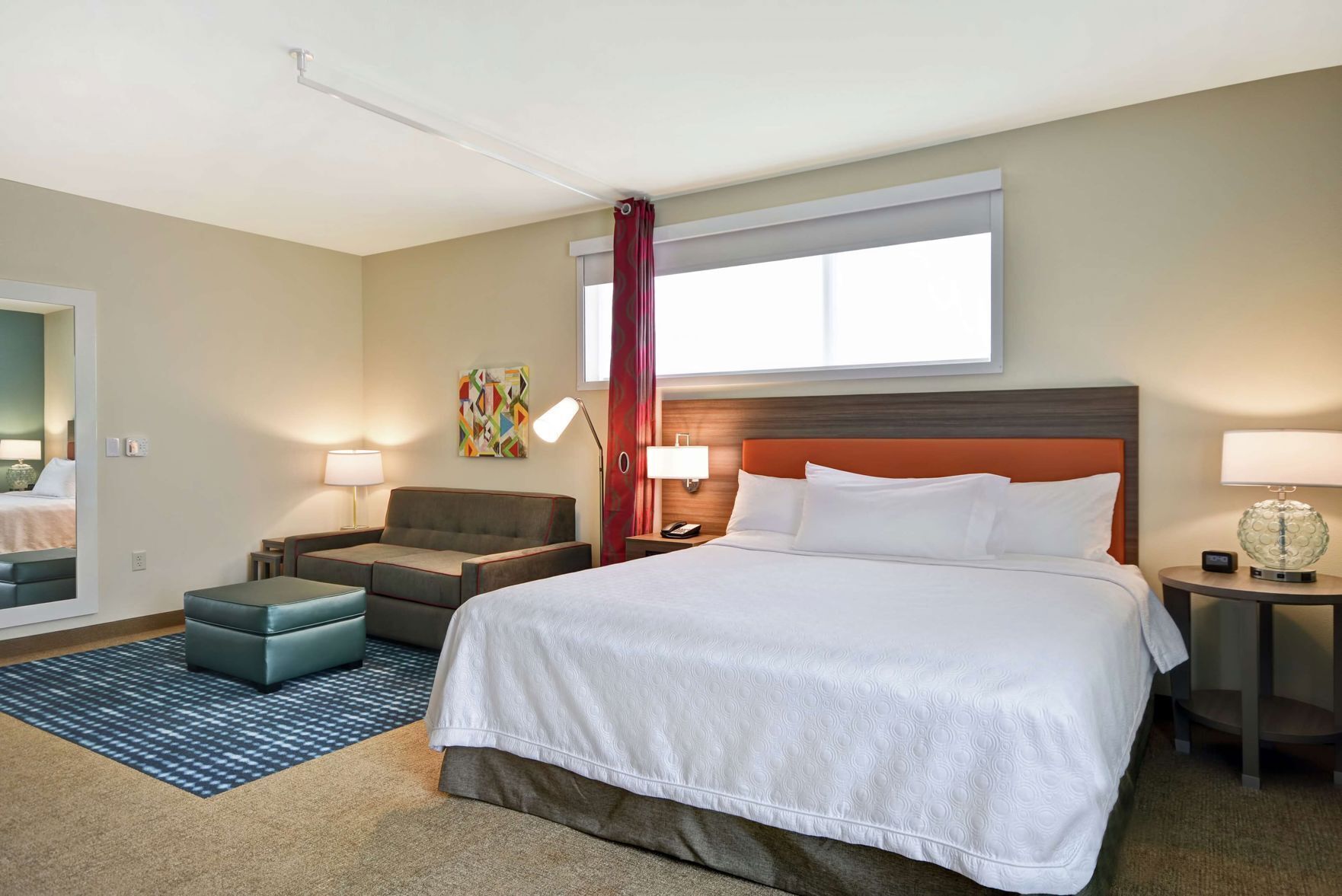 Premium bedding, desk, laptop workspace, blackout drapes