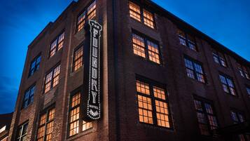 A brick building with a marquee sign reading "The Fonda Hotel."