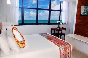 Premium Triple Room, Sea View | Minibar, in-room safe, desk, iron/ironing board