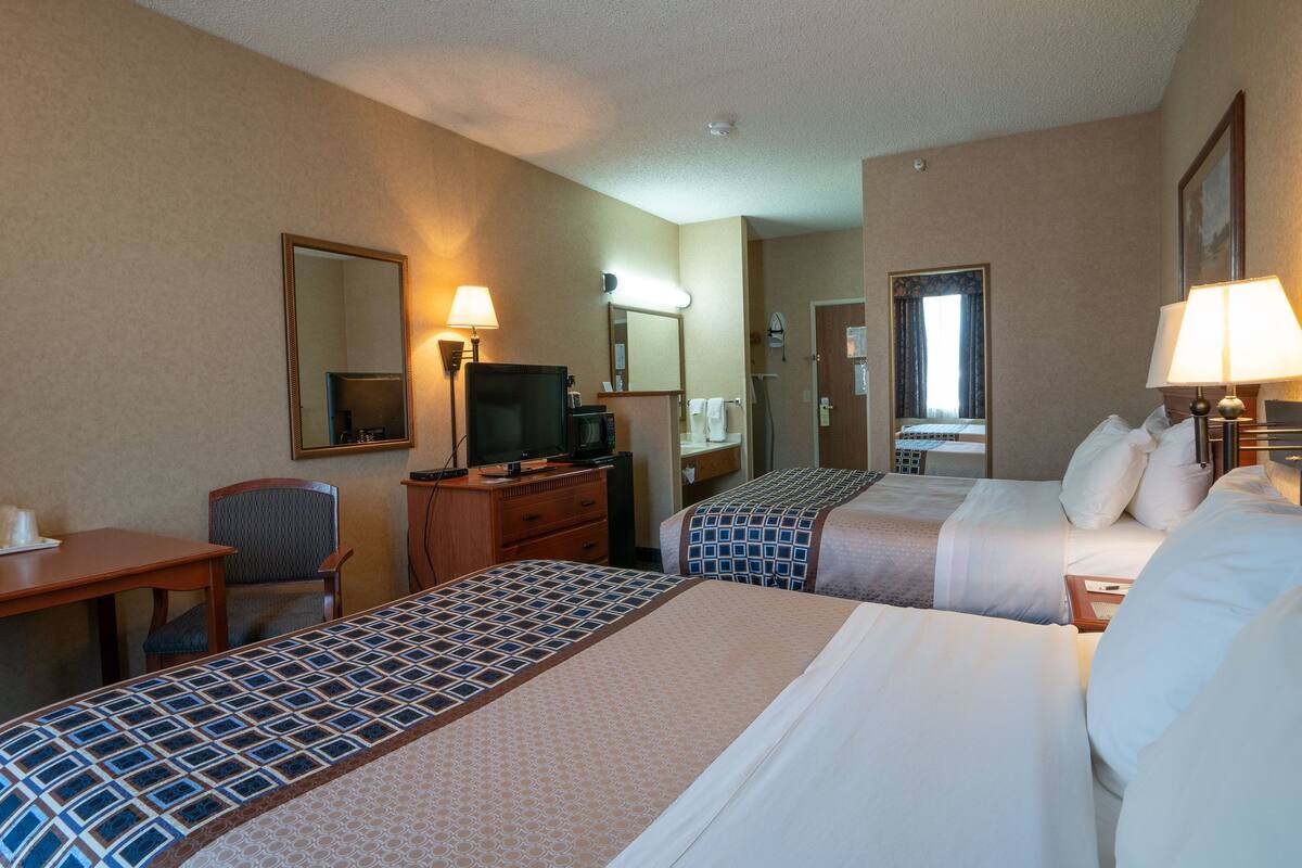 economy room, 2 queen beds | desk, laptop workspace, blackout curtains, iron/ironing board