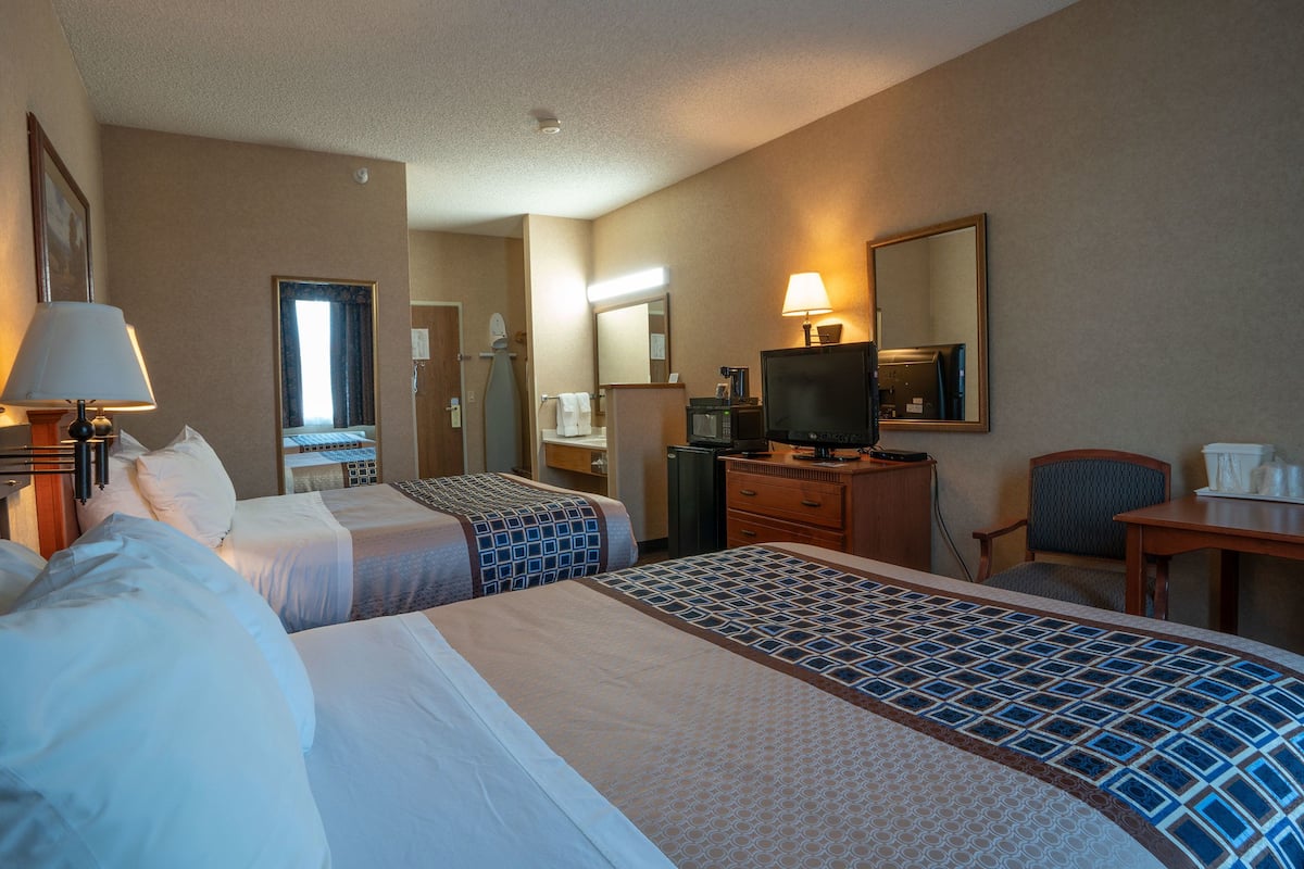 economy room, 2 queen beds | desk, laptop workspace, blackout curtains, iron/ironing board