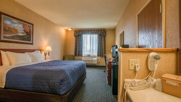 Economy Single Room, 1 King Bed | Laptop workspace, blackout drapes, iron/ironing board, WiFi (free)