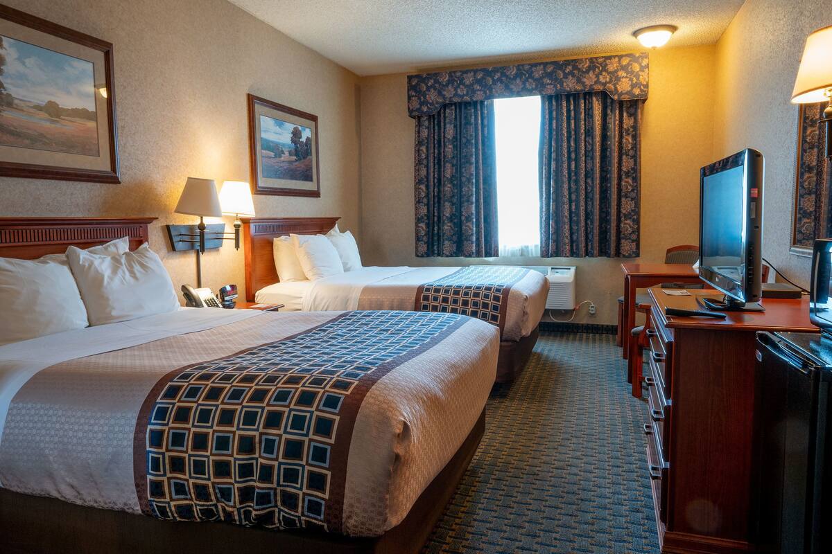 economy room, 2 queen beds | desk, laptop workspace, blackout curtains, iron/ironing board