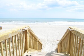On the beach, sun-loungers