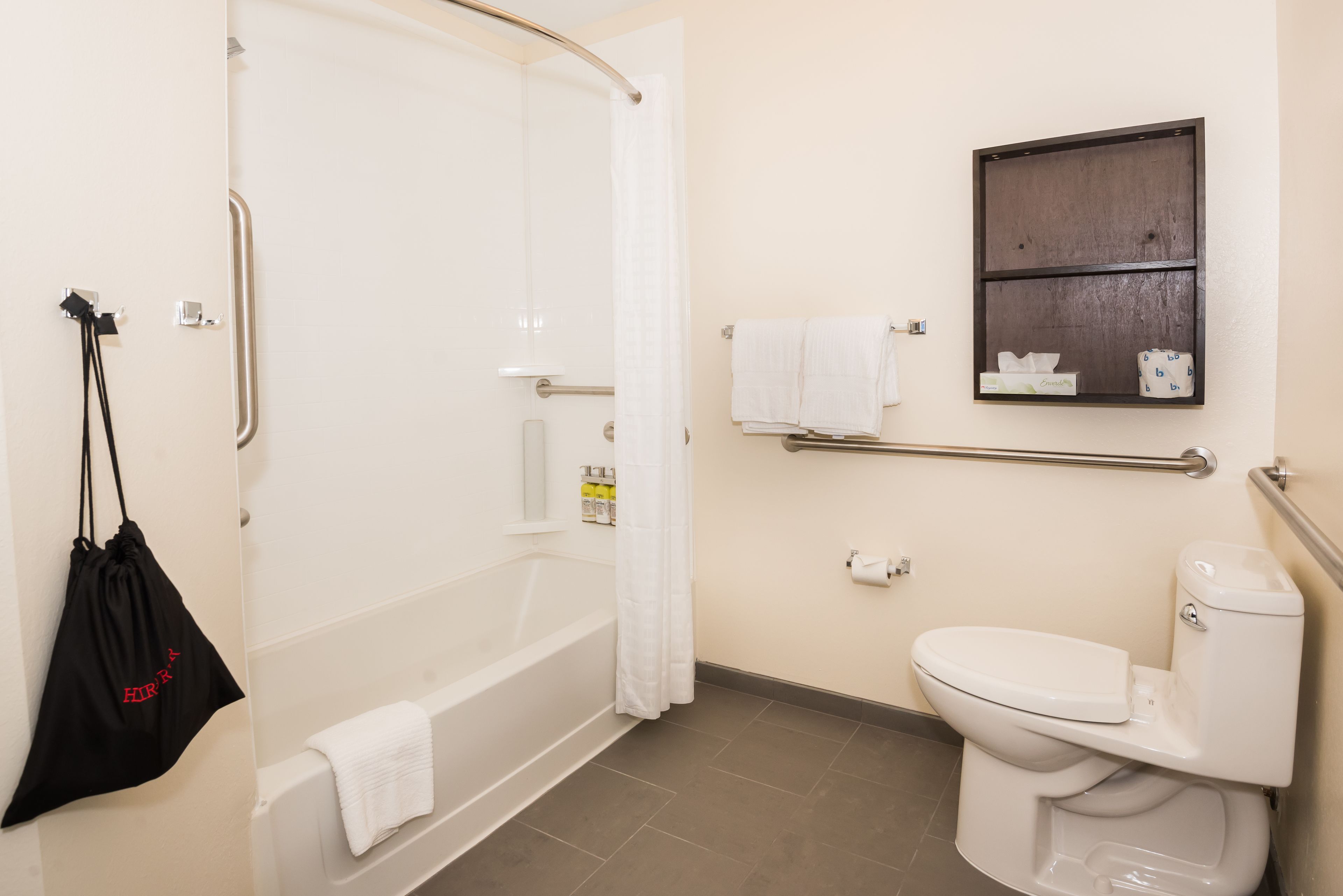 A bathroom with a bathtub, toilet, and a shower.