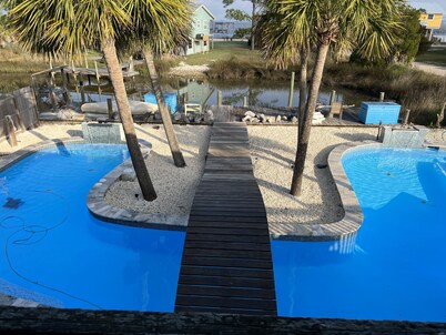St. George Island Waterfront Apt., Dock, Giant Saltwater Pool, & Fire Pit