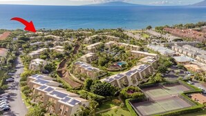 A resort with multiple buildings, a central pool, tennis courts, and a view of the ocean. - 1 Of Largest 2 Bedroom Units, 1 Of Highest # of 5 Star Reviews,Picture Sunsets. (Kihei)
