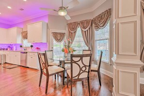 Enjoy meals in this well-appointed kitchen with a central island, dining table for four, and ample counter space.