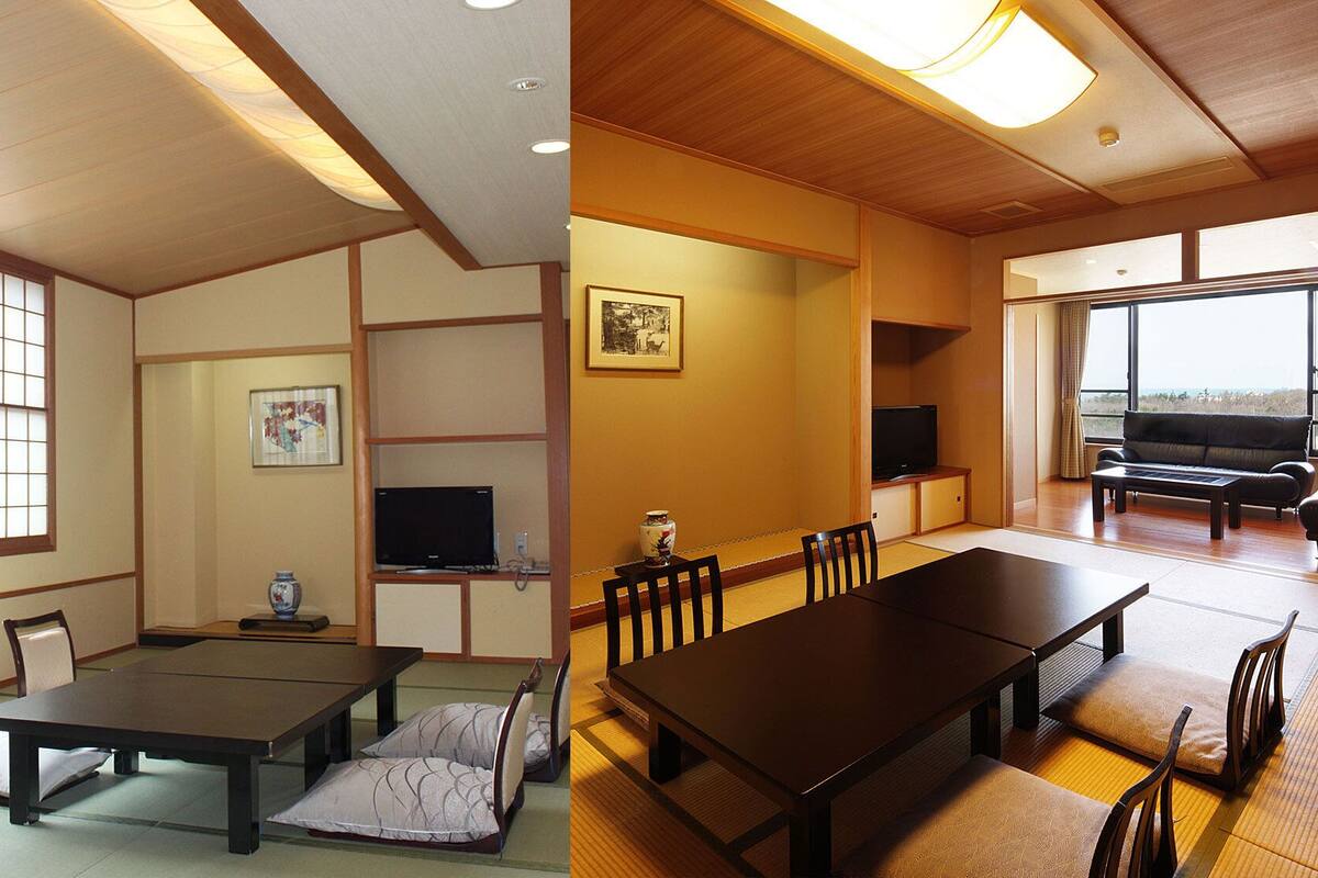 A traditional Japanese-style room with tatami flooring, a low table, and a sofa.