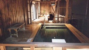 A wooden interior with a large rectangular pool, benches, and a staircase. - Shiobara Onsen Yuyado Umekawaso (Nasushiobara)