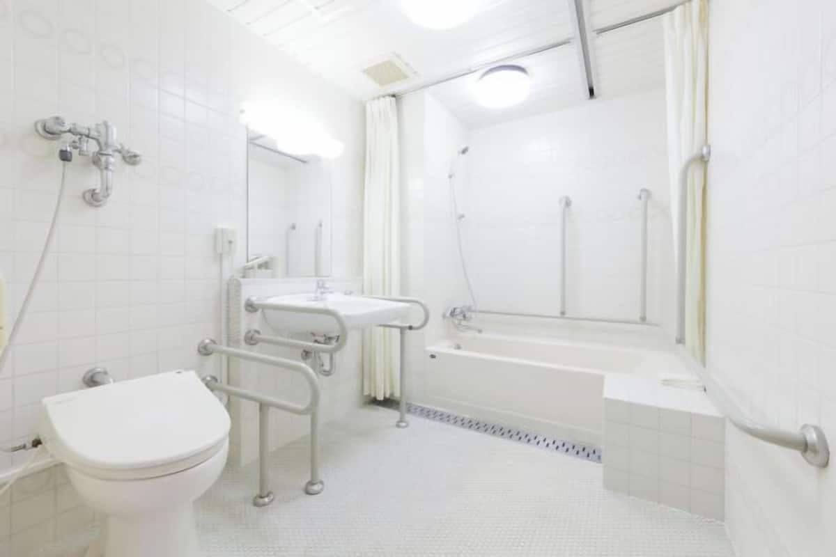 Bathroom | Hair dryer, slippers, electronic bidet, towels