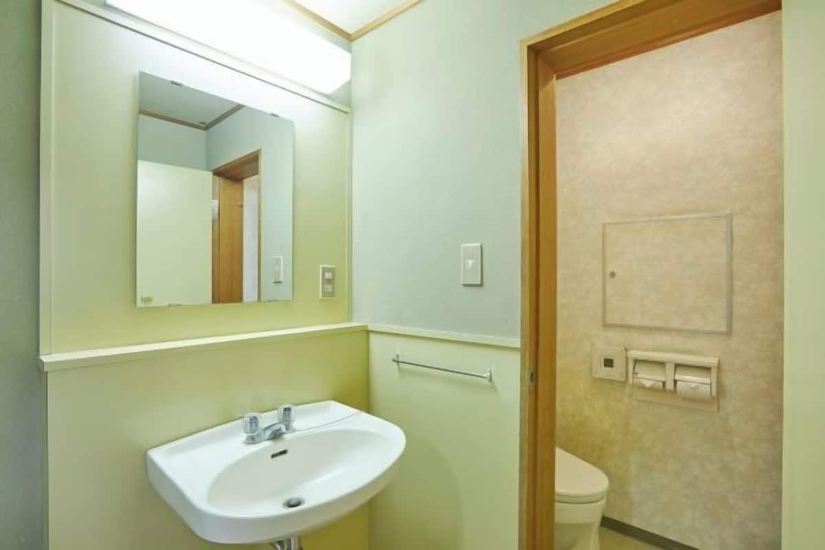Bathroom | Hair dryer, slippers, electronic bidet, towels