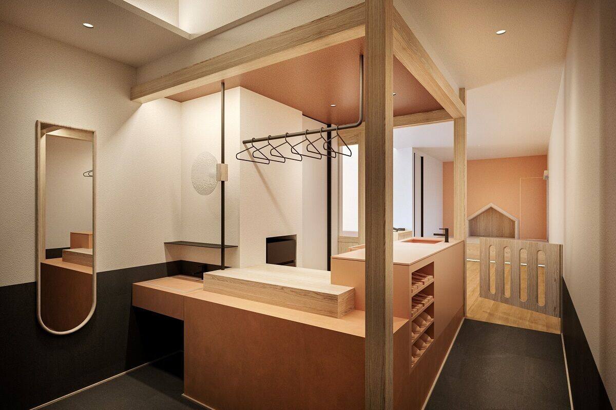 A modern bathroom with a wooden vanity, a mirror, and a towel rack.