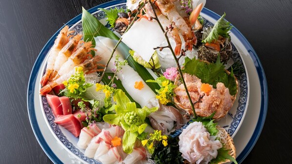 A plate of assorted seafood and vegetables.