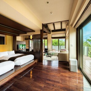 A modern hotel room with a large bed, a seating area, and a view of the outdoors. - Okuyado Buaisou (Yufu)