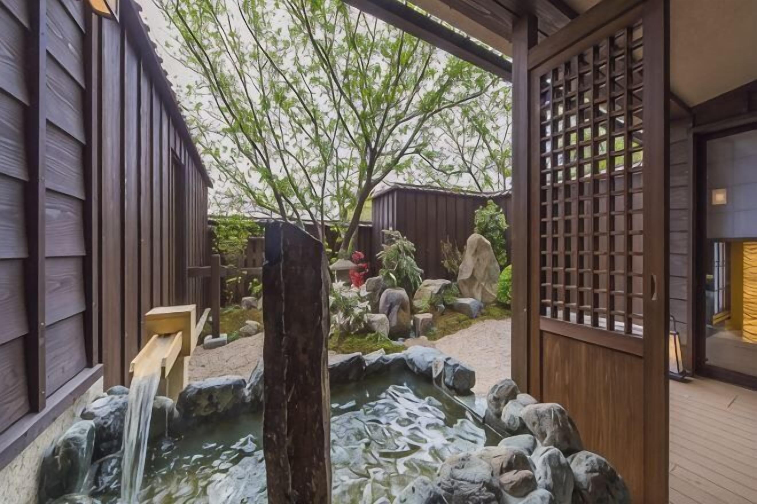 A traditional Japanese garden with a koi pond, wooden structures, and a wooden gate.