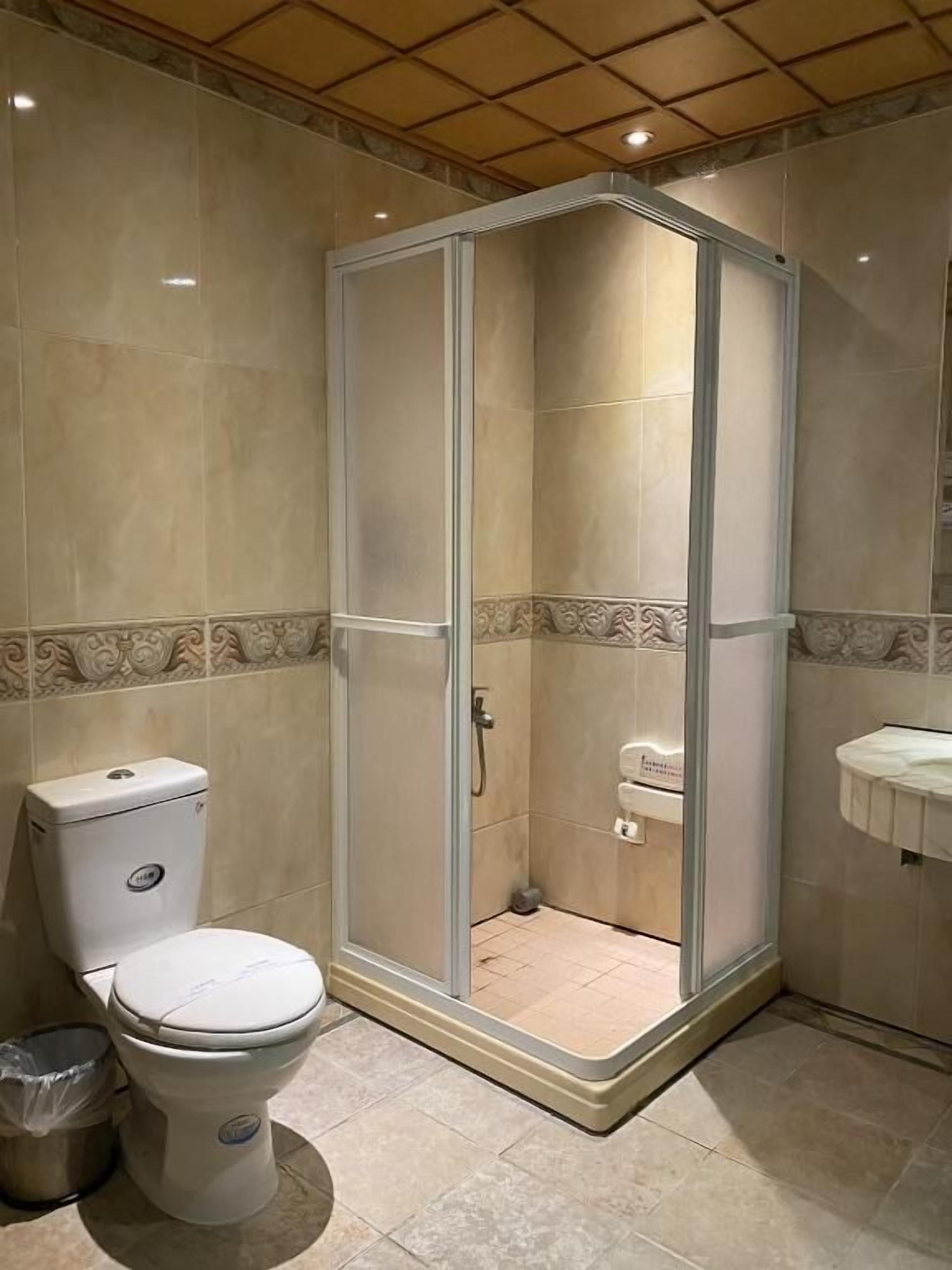 deluxe quadruple room | bathroom | bathtub, free toiletries, hair dryer, slippers