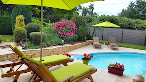 Outdoor pool, pool umbrellas, pool loungers