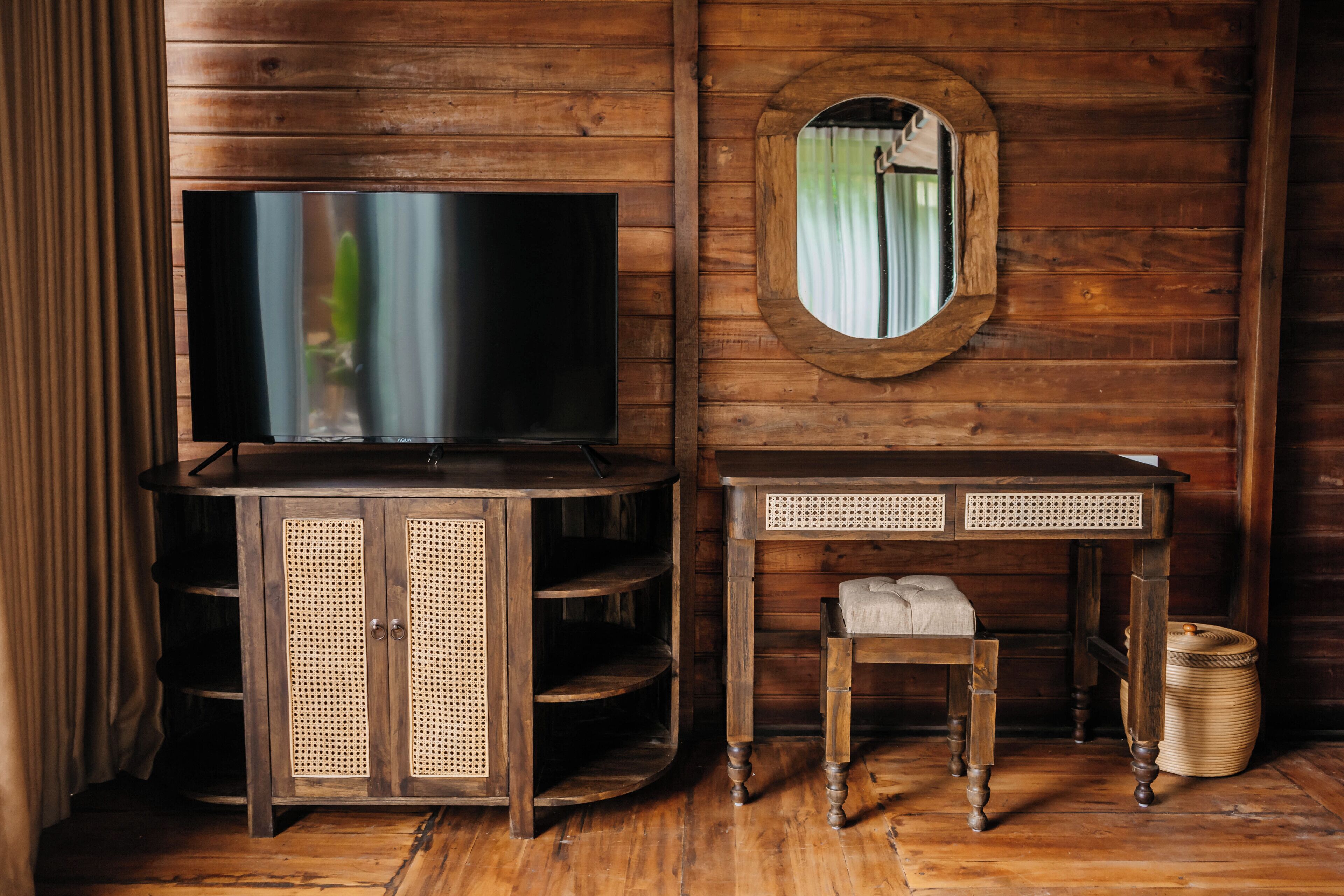 one bedroom wooden villa with pool | television