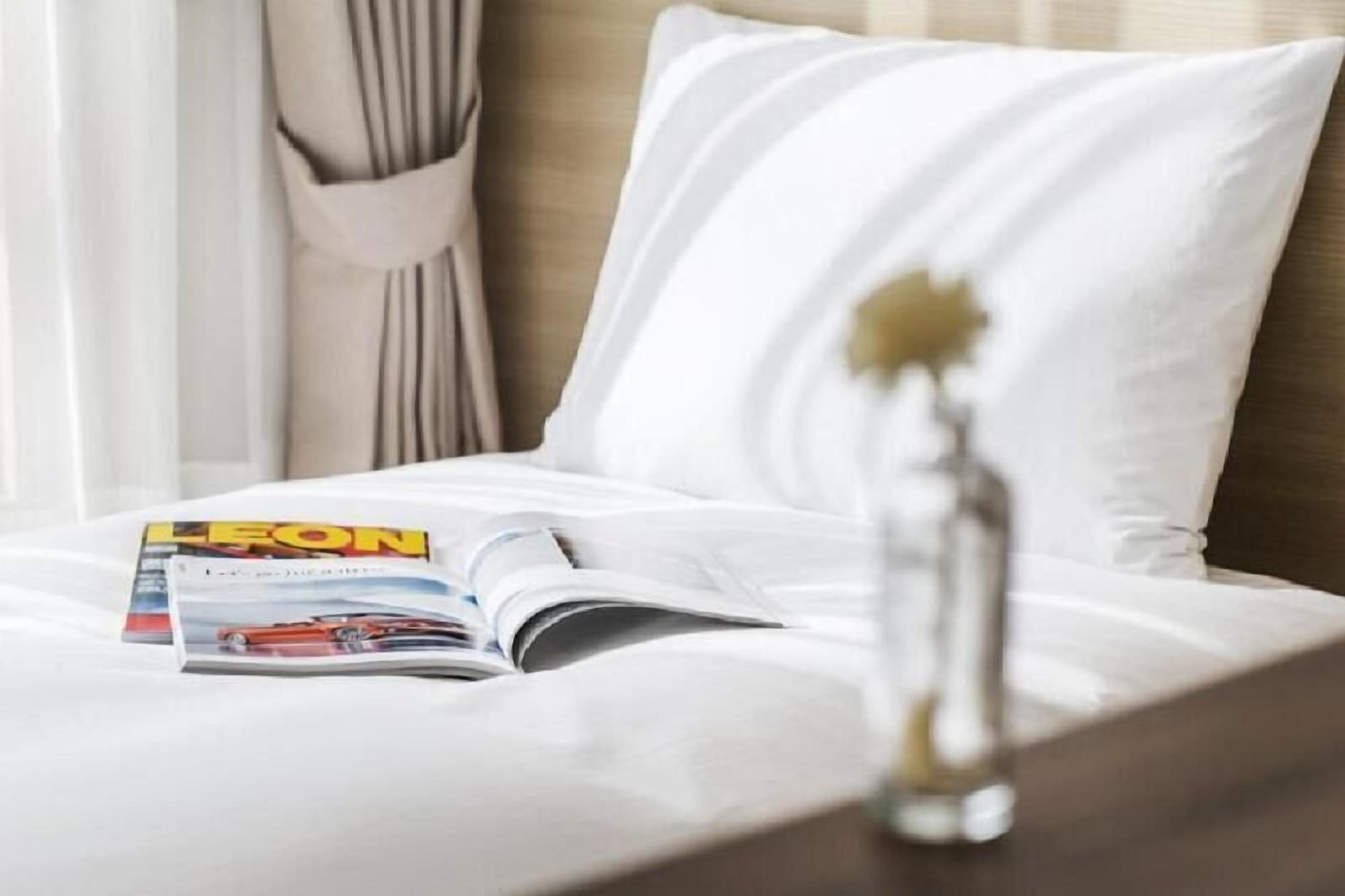 Premium bedding, down duvets, blackout curtains, free WiFi