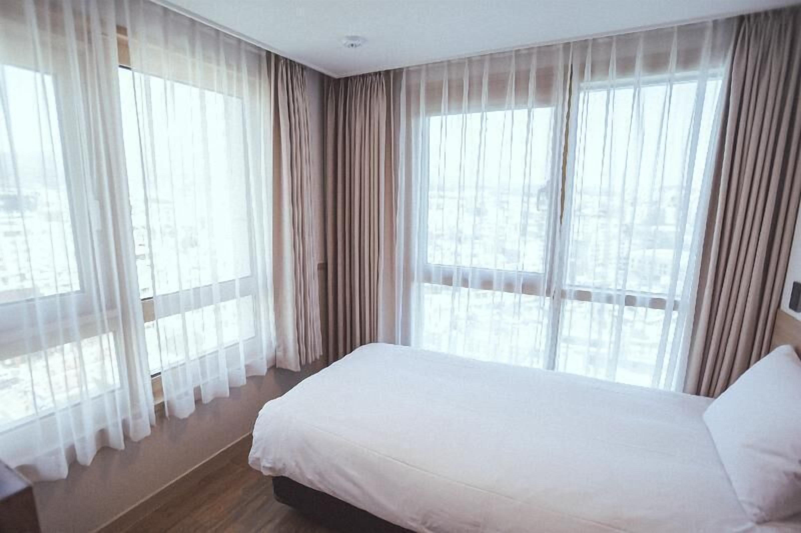 Premium bedding, down duvets, blackout curtains, free WiFi