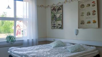 Basic Triple Room, Shared Bathroom | Iron/ironing board, free cribs/infant beds, free WiFi