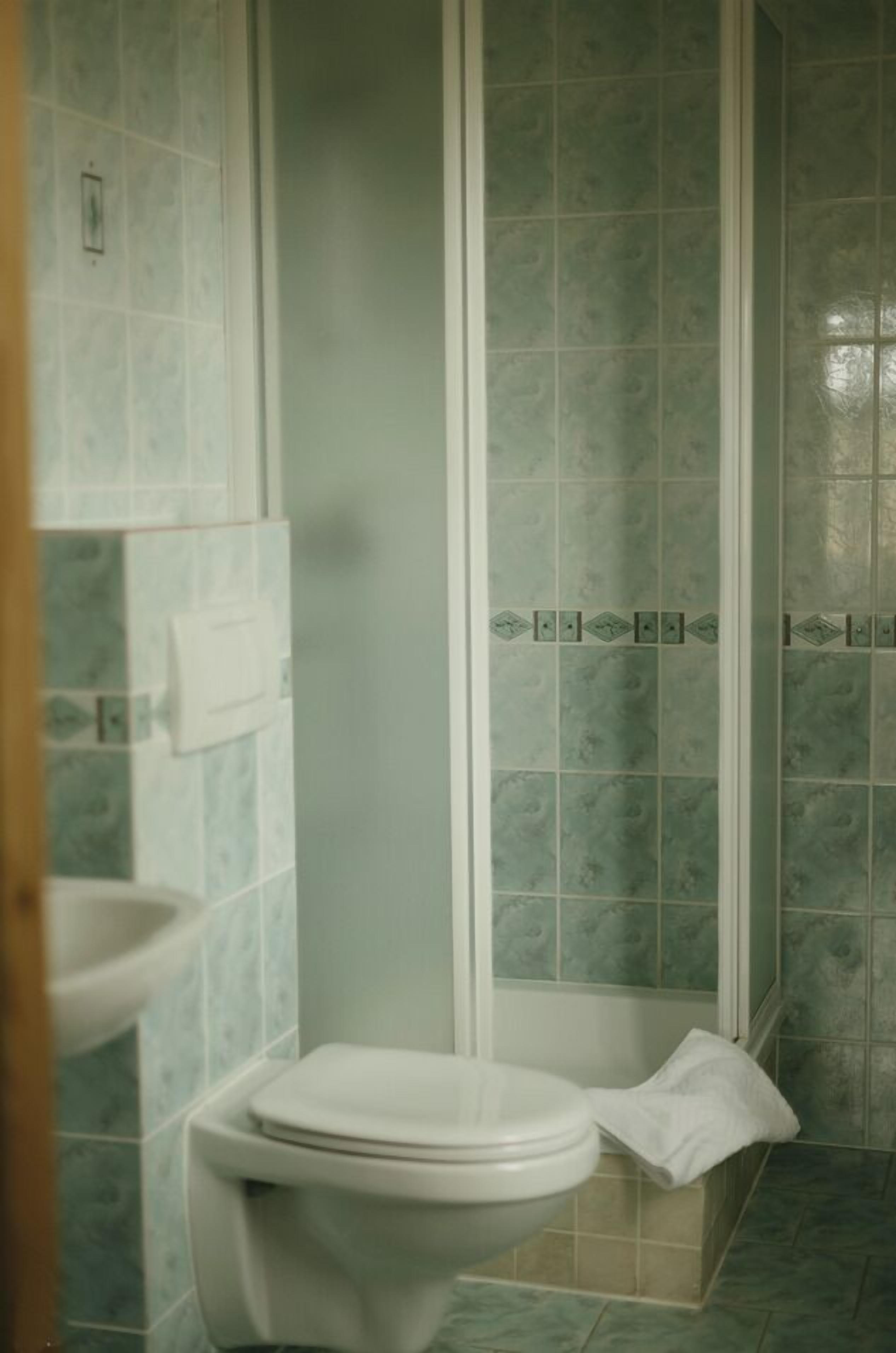 Shower, deep-soaking bathtub, hair dryer, bathrobes